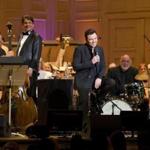 Seth McFarlane (front, center) with conductor Keith Lockhart  (second from left) and the Boston Pops on Friday. 